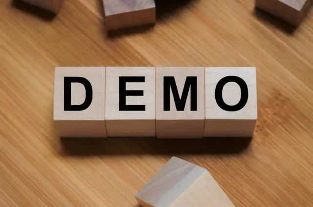 Demo text on wooden blocks representing test account usage.